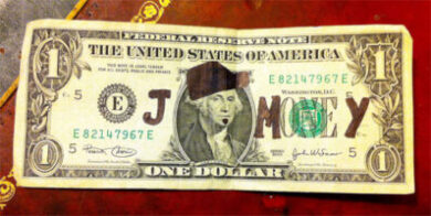 Is it illegal to write or draw on money?